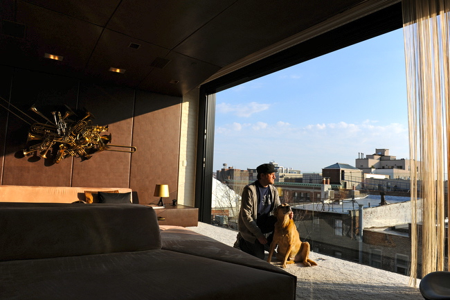 Sherman's living room is open air. Glass pane prevents falling out.